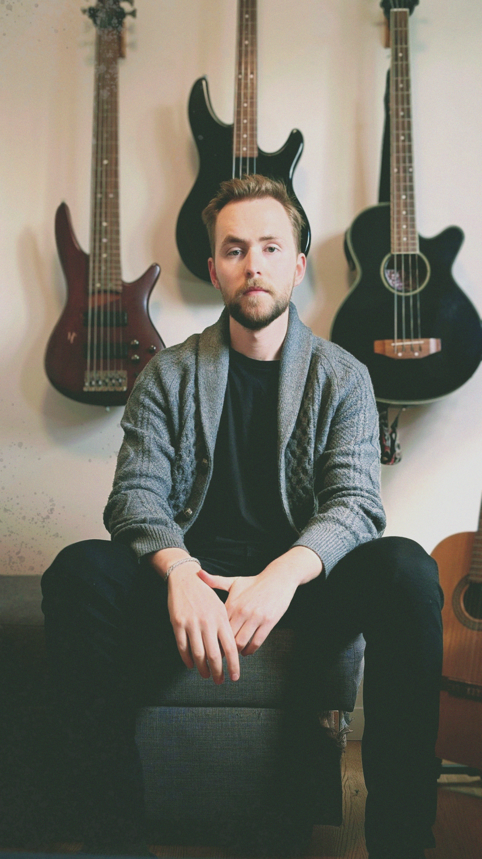 A portrait of a man with short blonde hair and a beard